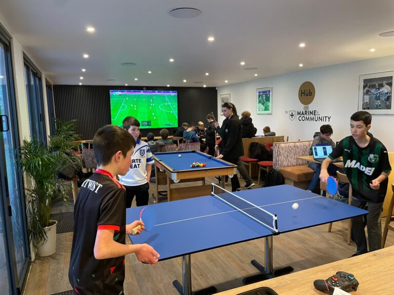 Young people playing table tennis at the Marine Youth Club